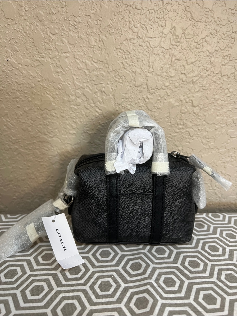 Coach Mini Trekker bag charm in Black CBK63 gunmetal hardware